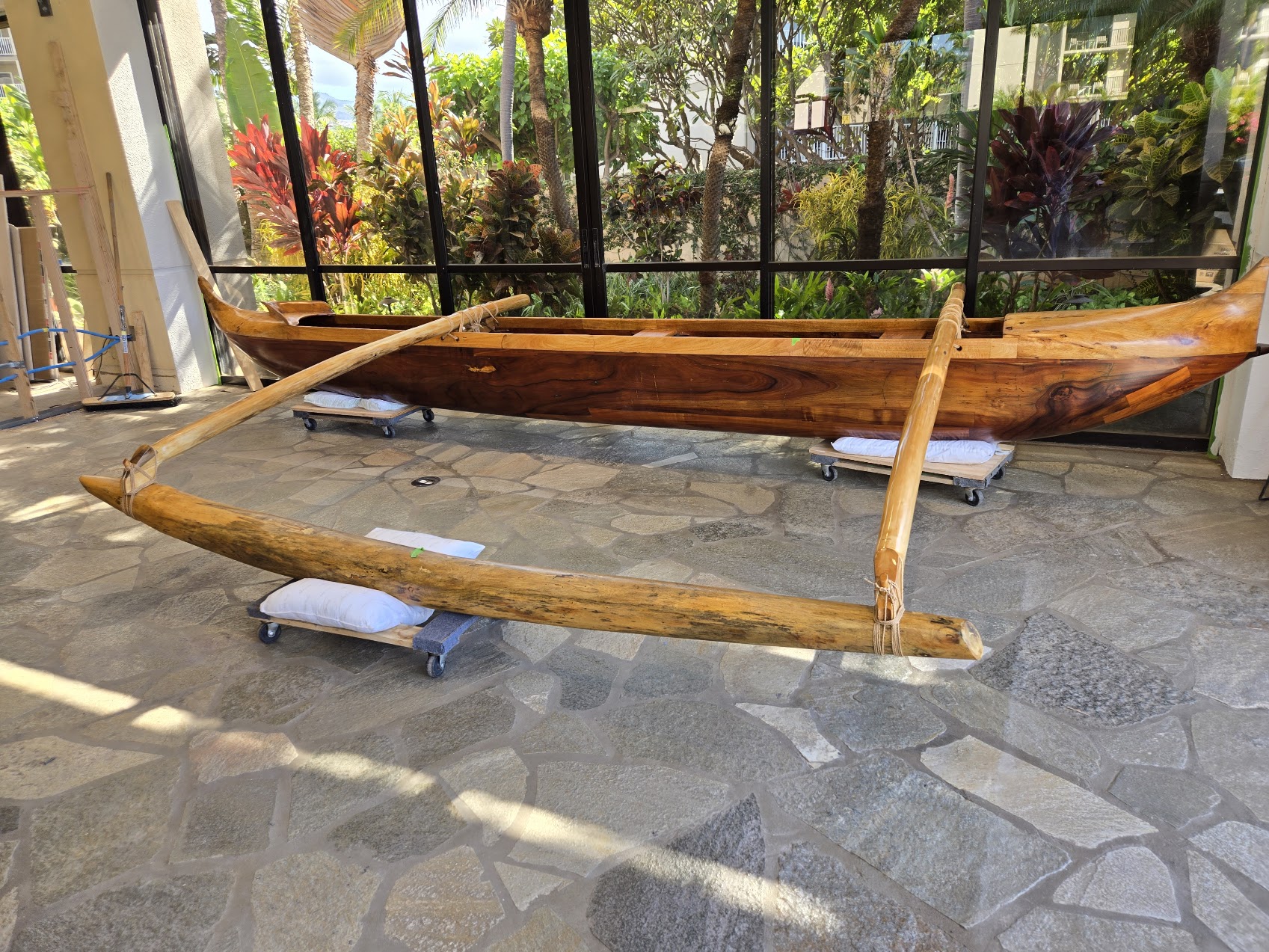 Canoe displayed indoors with ama