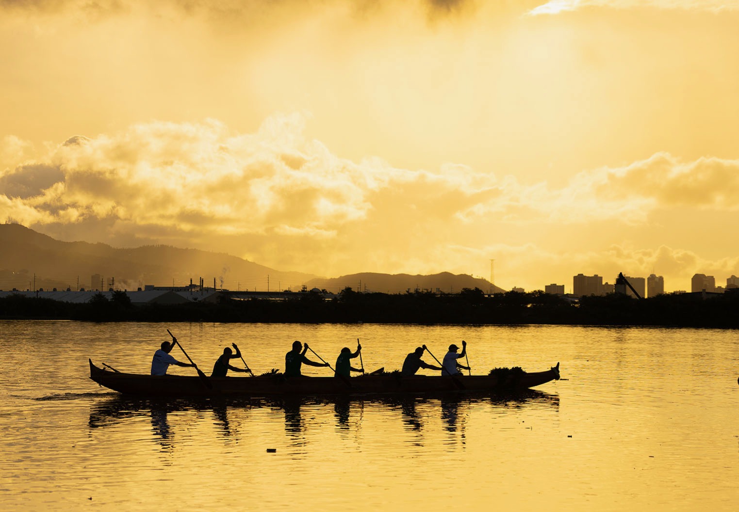 Canoe silhouette at sunset